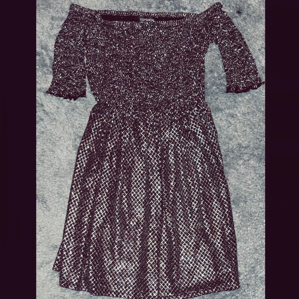 Beautiful sparkly off the shoulder dress.